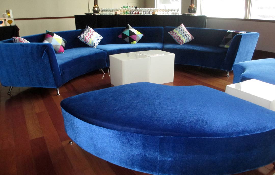 Sapphire-lounge-furniture-with-curved-couch-and-ottomans