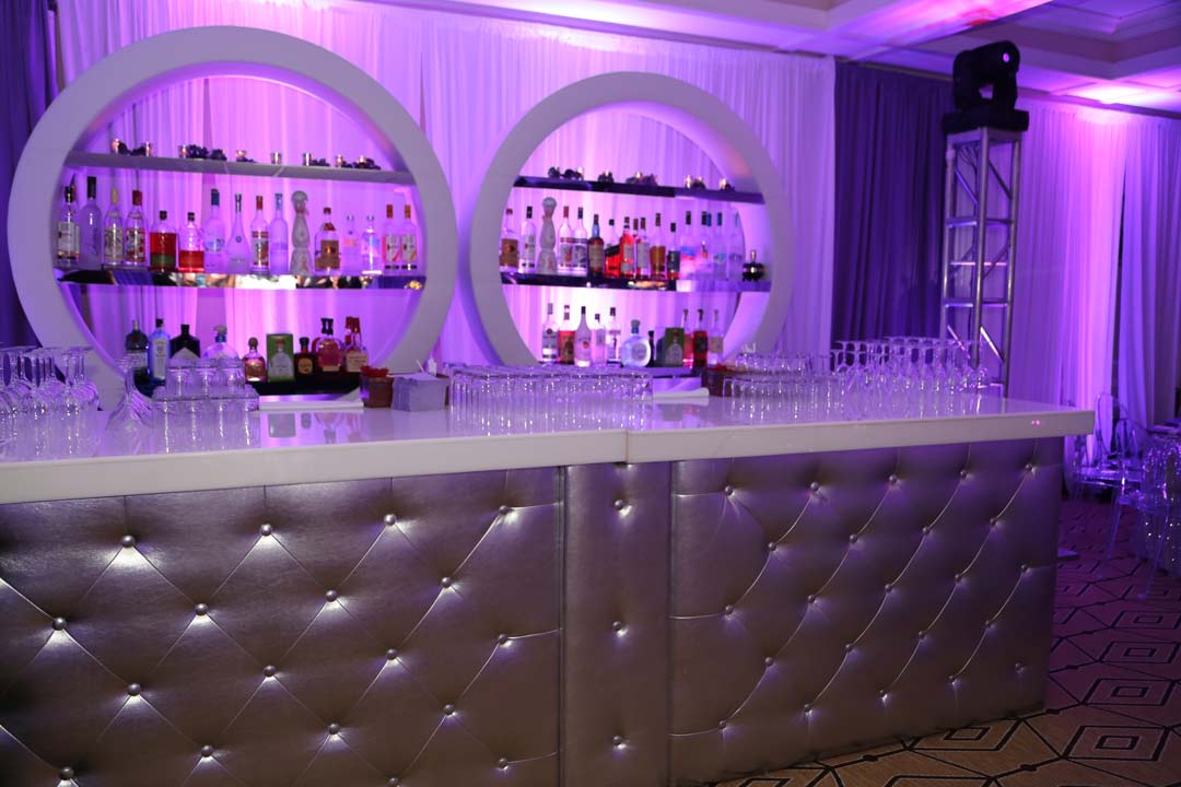 Silver-tufted-bar-with-round-shelves