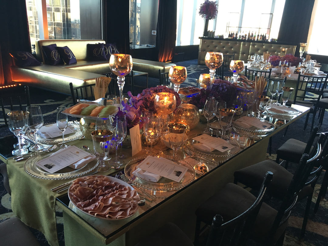 Event-production-gold-lounge-decor-with-gold-tufted-bar-andfancy-dinner-table-settings